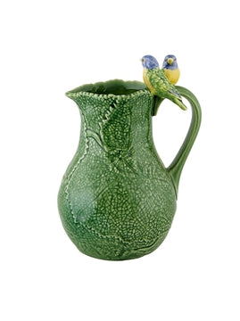 A twin blue bird and cinneraria leaf earthenware pitcher by Bordallo Pinheiro, Portugal