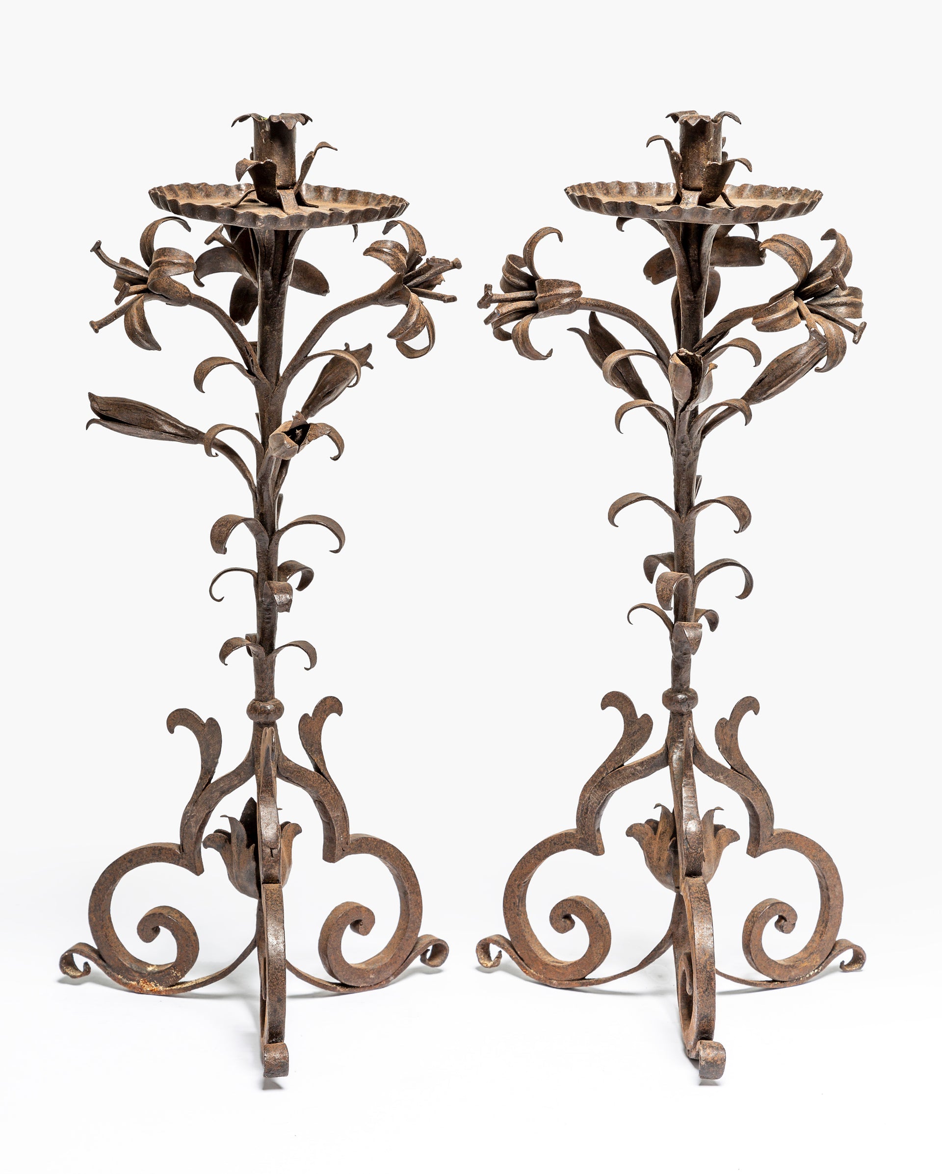 A beautiful pair of wrought iron lily design candlearbra, French 19th Century