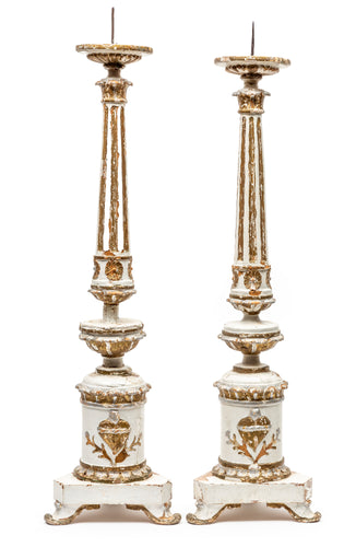 A matched pair of imposing carved, painted and gilded timber candlearbra, French 18th Century