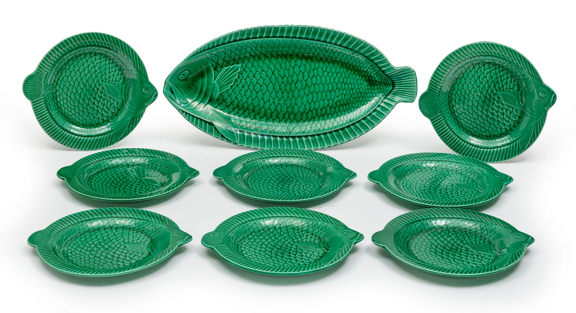 A fabulous green glazed fish service of eight plates and large platter, French Circa 1950