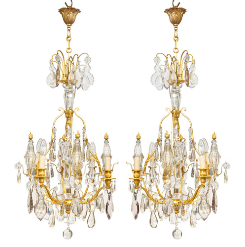 A exquisite pair of gilt bronze and crystal four-light obelisk chandeliers, French Circa 1930