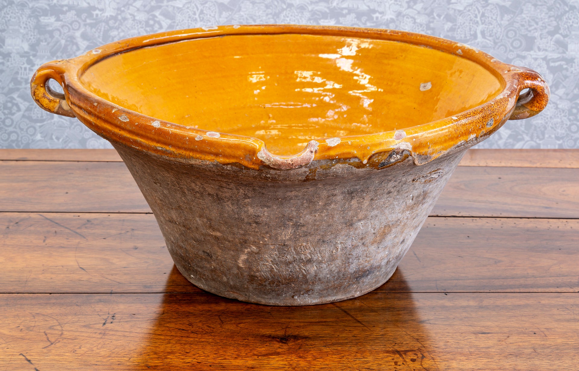 A large mustard glazed terracotta chestnut bowl, French 19th Century