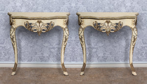 A highly decorative pair of serpentine fronted gilt painted and carved console tables, French Circa 1950