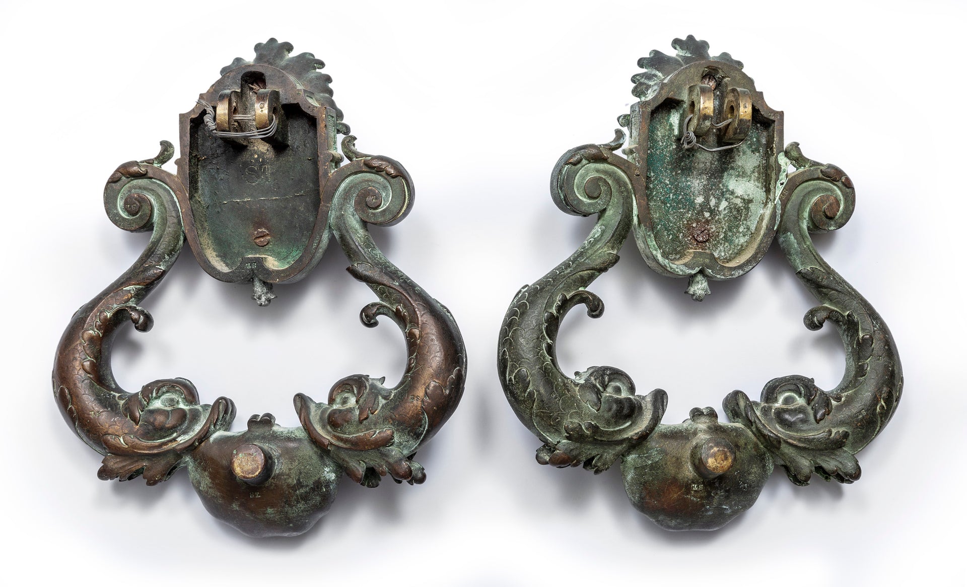 An exceptional pair of bronze door knockers, cast with the head of Neptune and twin dolphins French 19th Century