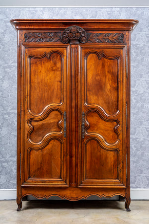 A grand provincial walnut armoire, French late 18th, early 19th Century