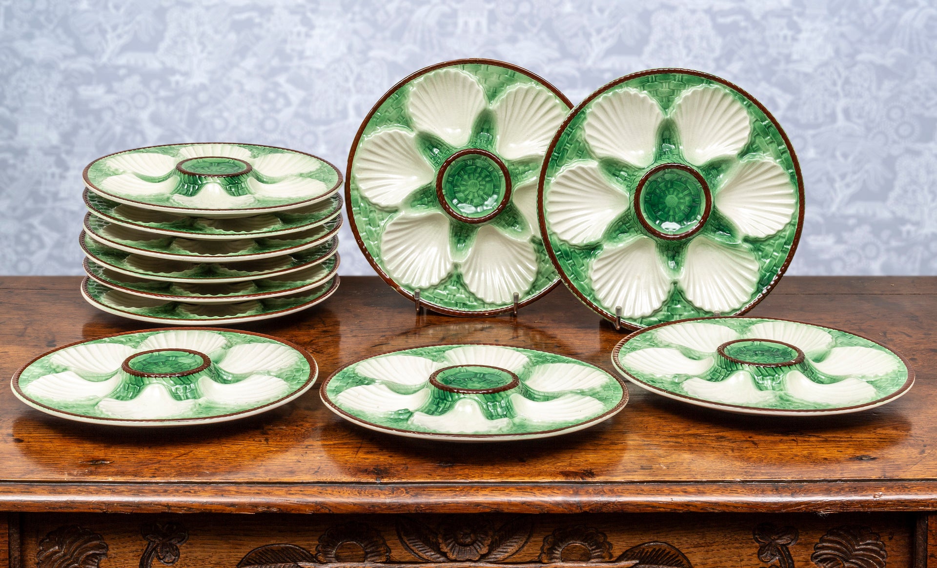 SOLD A set of ten green, white and chocolate rimmed faience scallop plates, French Circa 1950