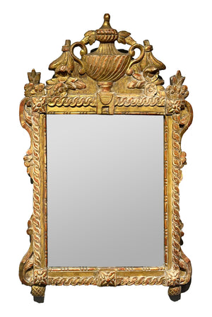 A beautifully carved giltwood wall mirror, French 18th Century