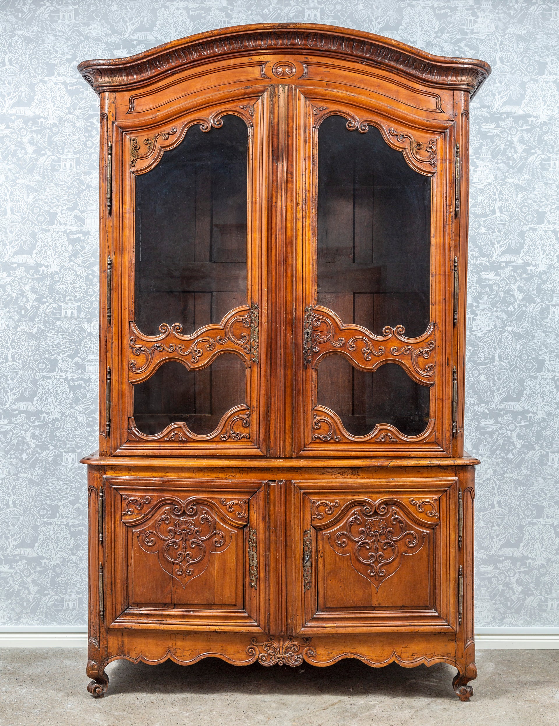 SOLD A superb French provincial carved walnut buffet a deux-corps, French late 18th Century