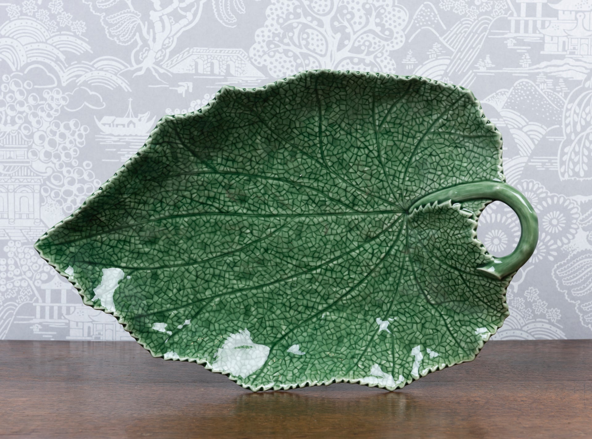 A large Cinneraria leaf green glazed platter by Bordallo Pinheiro, Portugal