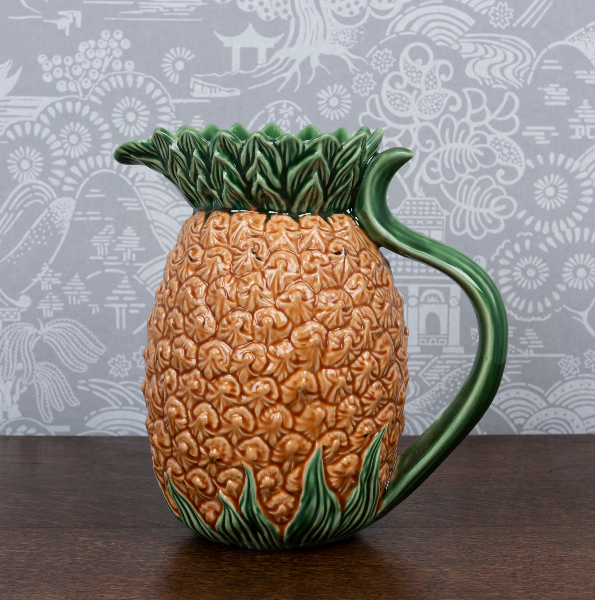 A glazed earthenware pineapple form pitcher by Bordallo Pinheiro, Portugal